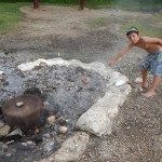 Cooking a breadfruit in the hot springs